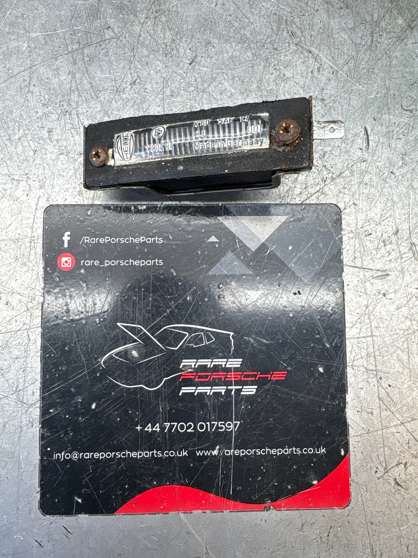 Porsche 924 / 944 rear number plate light housing 477943021A