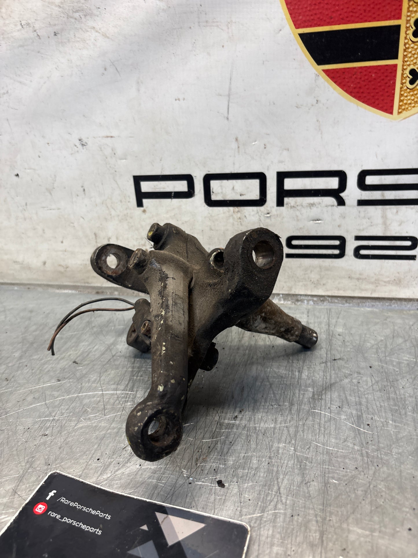 Porsche 928 left steering spindle knuckle, used 92834105717