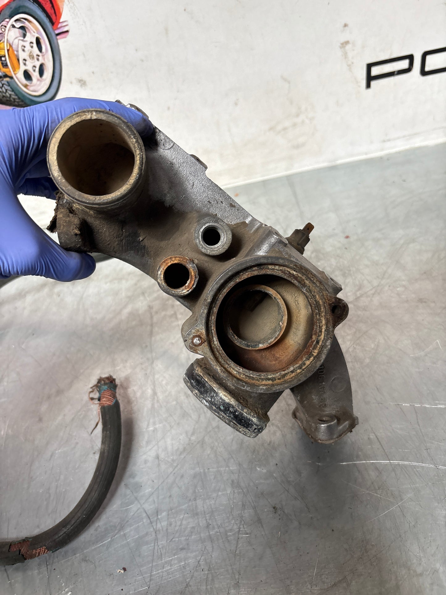 Porsche 928 thermostat housing, used 9281061616R
