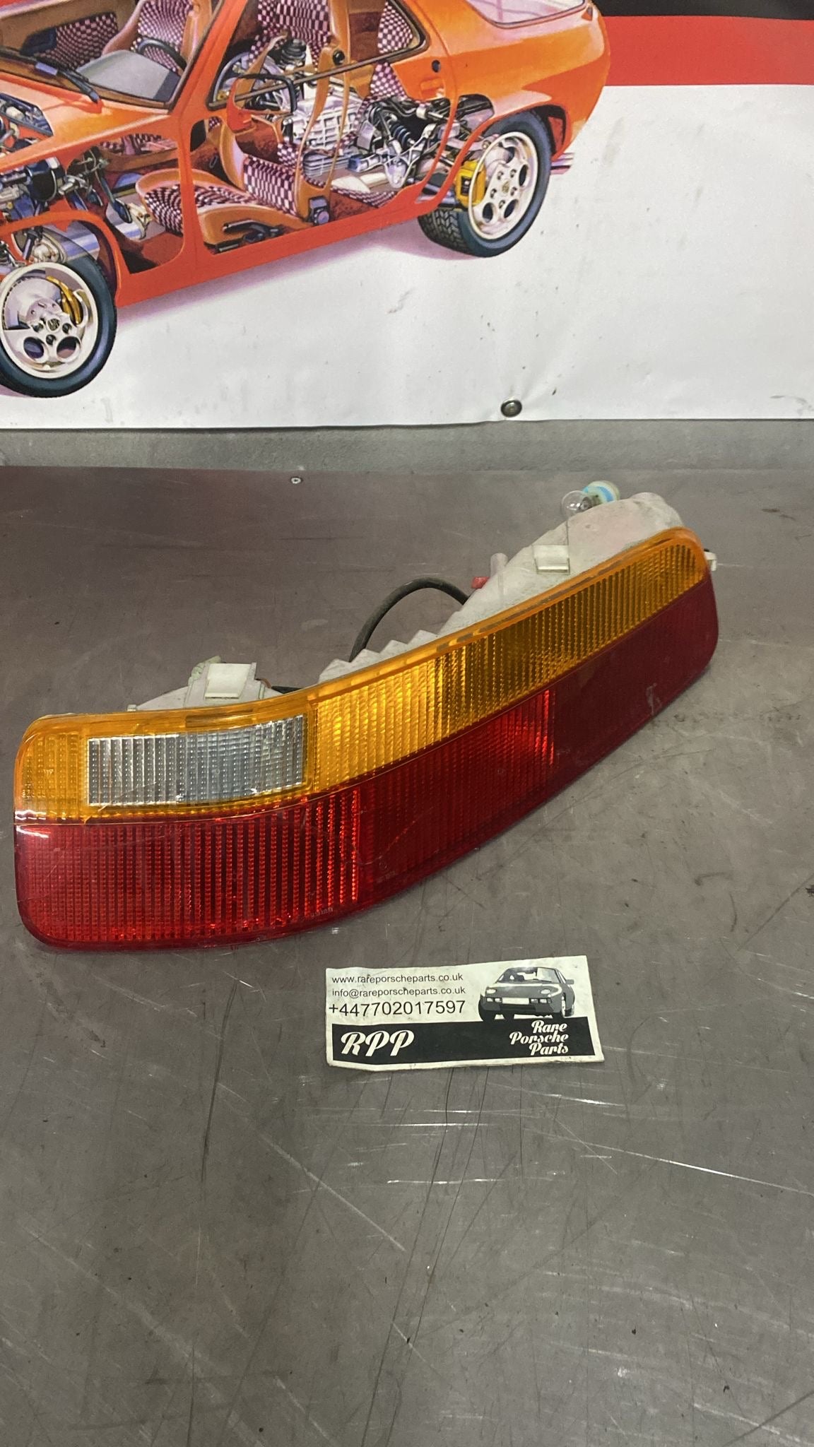 Porsche 928 rear right tail light, used 92863104401, cracked