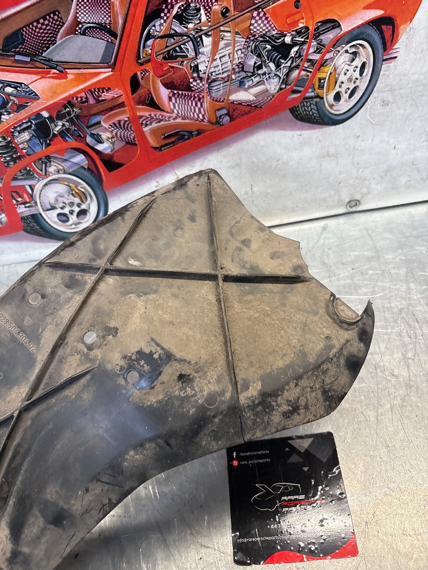 Porsche 928 rear right fender wheel cover, used 92850430402