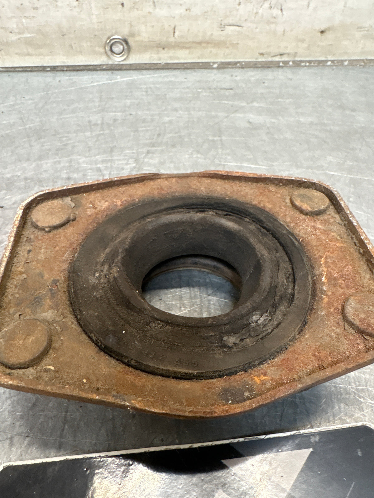 Porsche 924 / 944 front suspension bearing flange, 477412345, used
