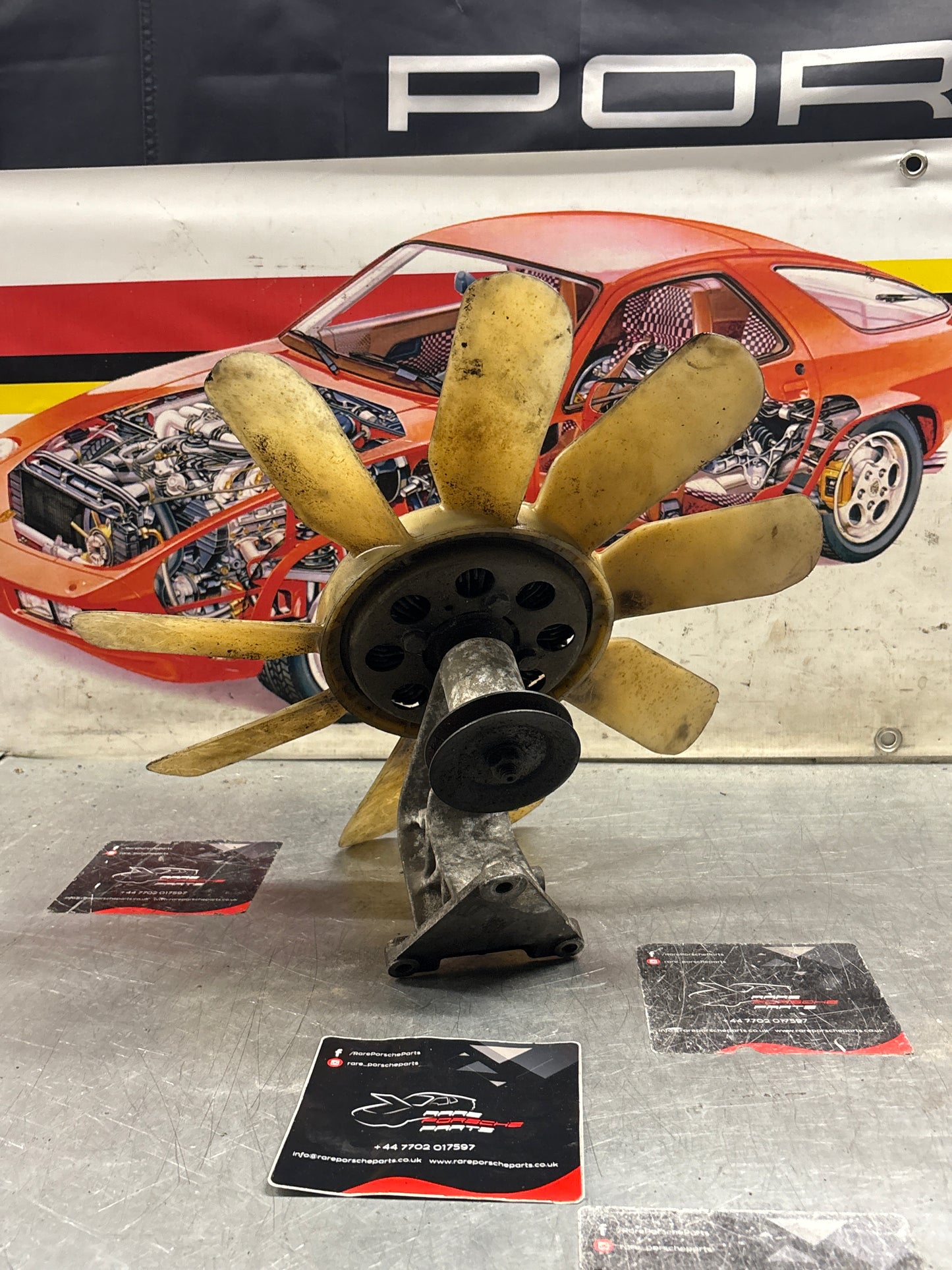 Porsche 928 late engine cooling fan clutch with bracket, used 92810611205 / 92810613701 / 9281061104R