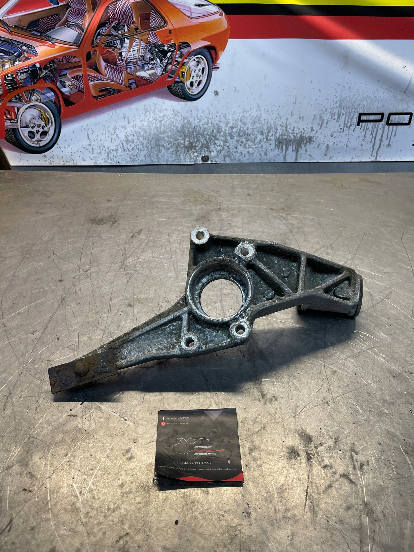 Porsche 924 / 944 right rear torsion bar mount, used 477501660B