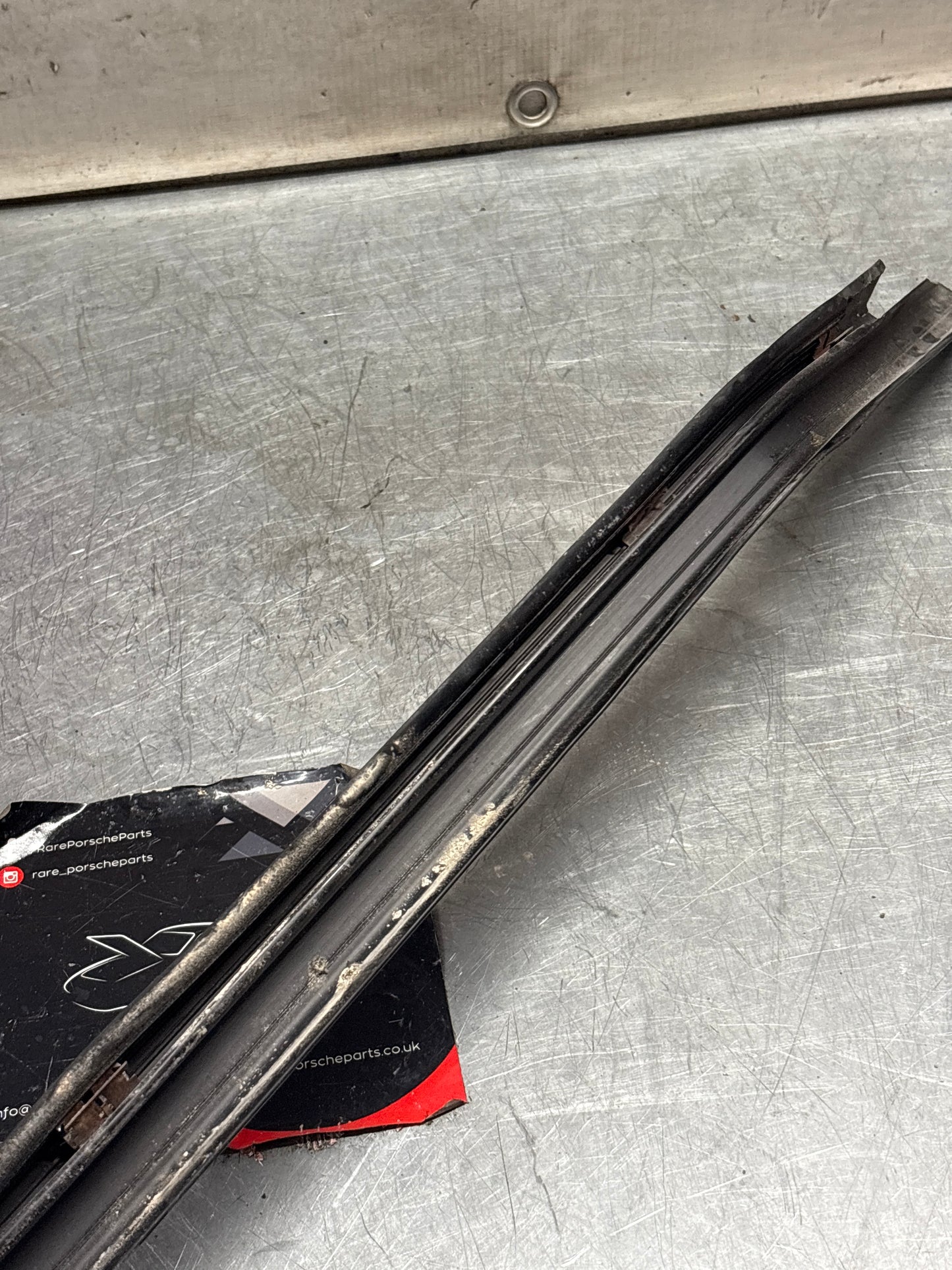 Porsche 944 85.5- left sill trim, scuff plate used 94455112100 cracked