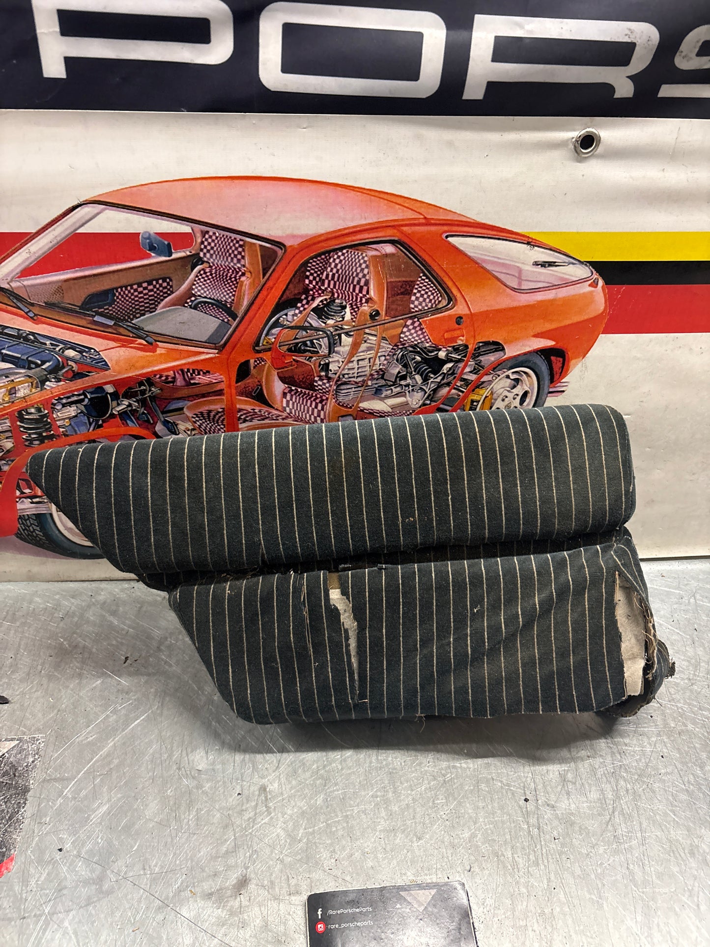 Porsche 928 rear left seat cushion, black-white pinstripe , carpeted, used 92852205951