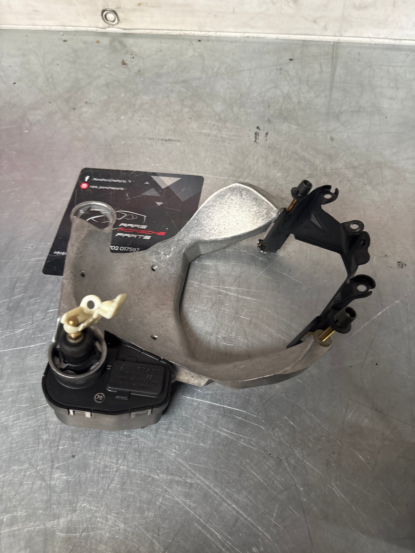 Porsche 968 headlight bracket housing, left 1305541099