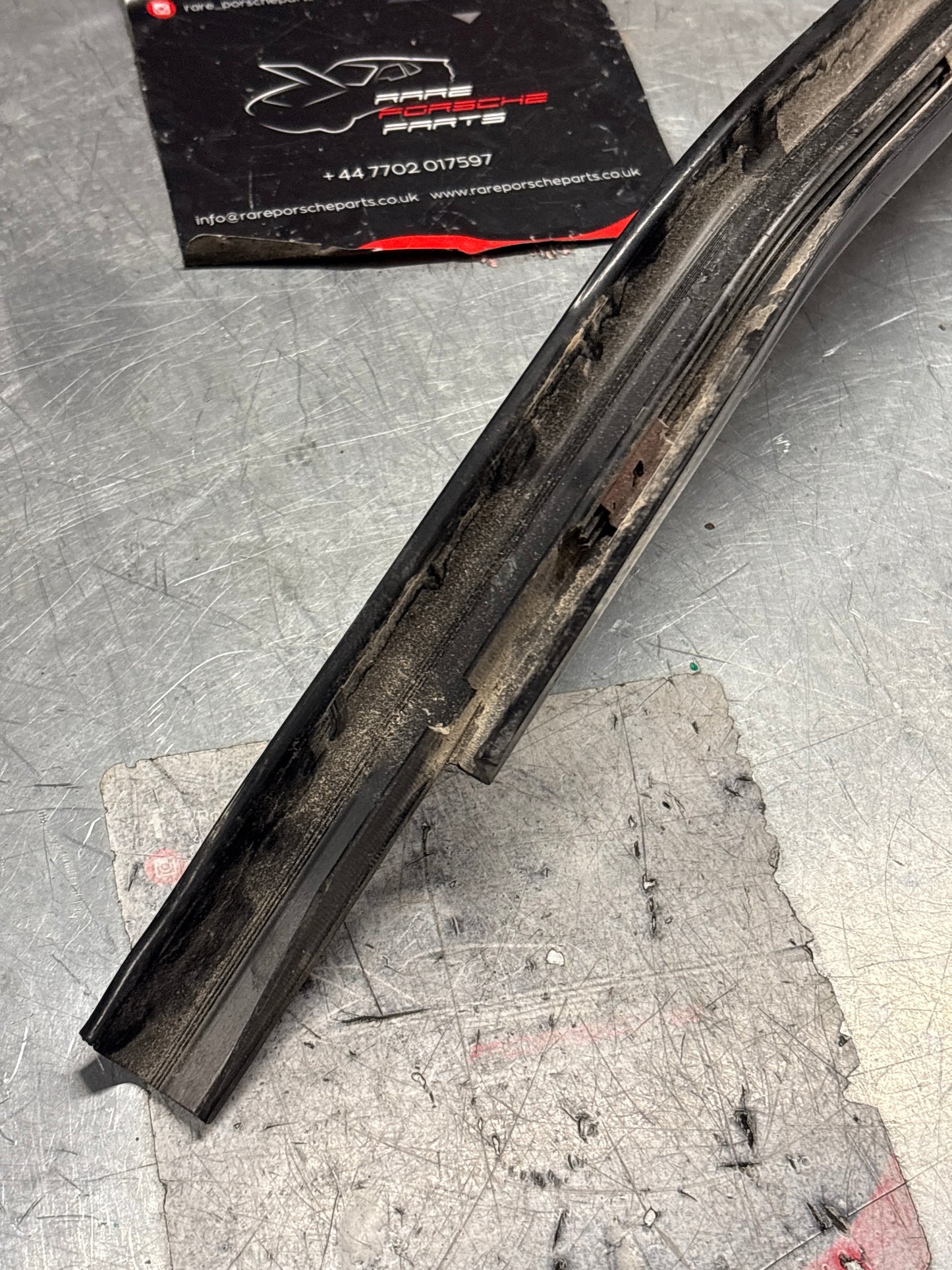 Porsche 944 85.5- left sill trim, scuff plate used 94455112100 cracked