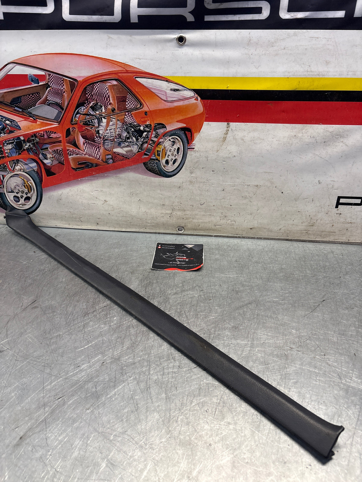 Porsche 928 tailgate trim, left, near side, marine blue, 92855503702, used