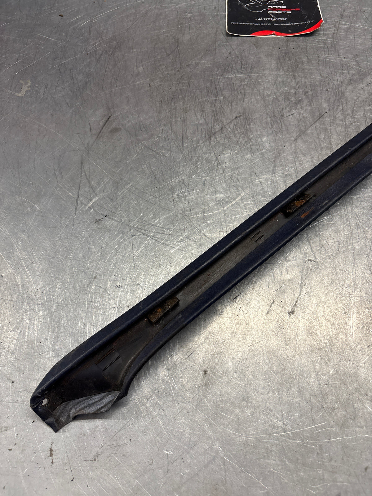 Porsche 928 tailgate trim, left, near side, marine blue, 92855503702, used