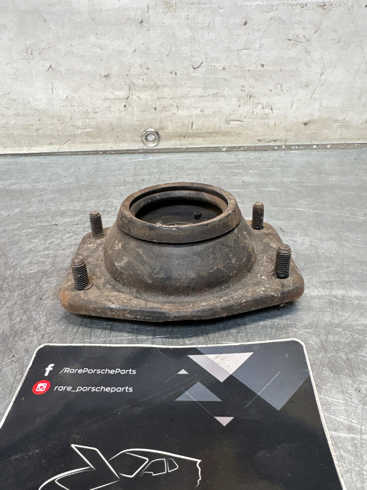Porsche 924 / 944 front suspension bearing flange, 477412345, used