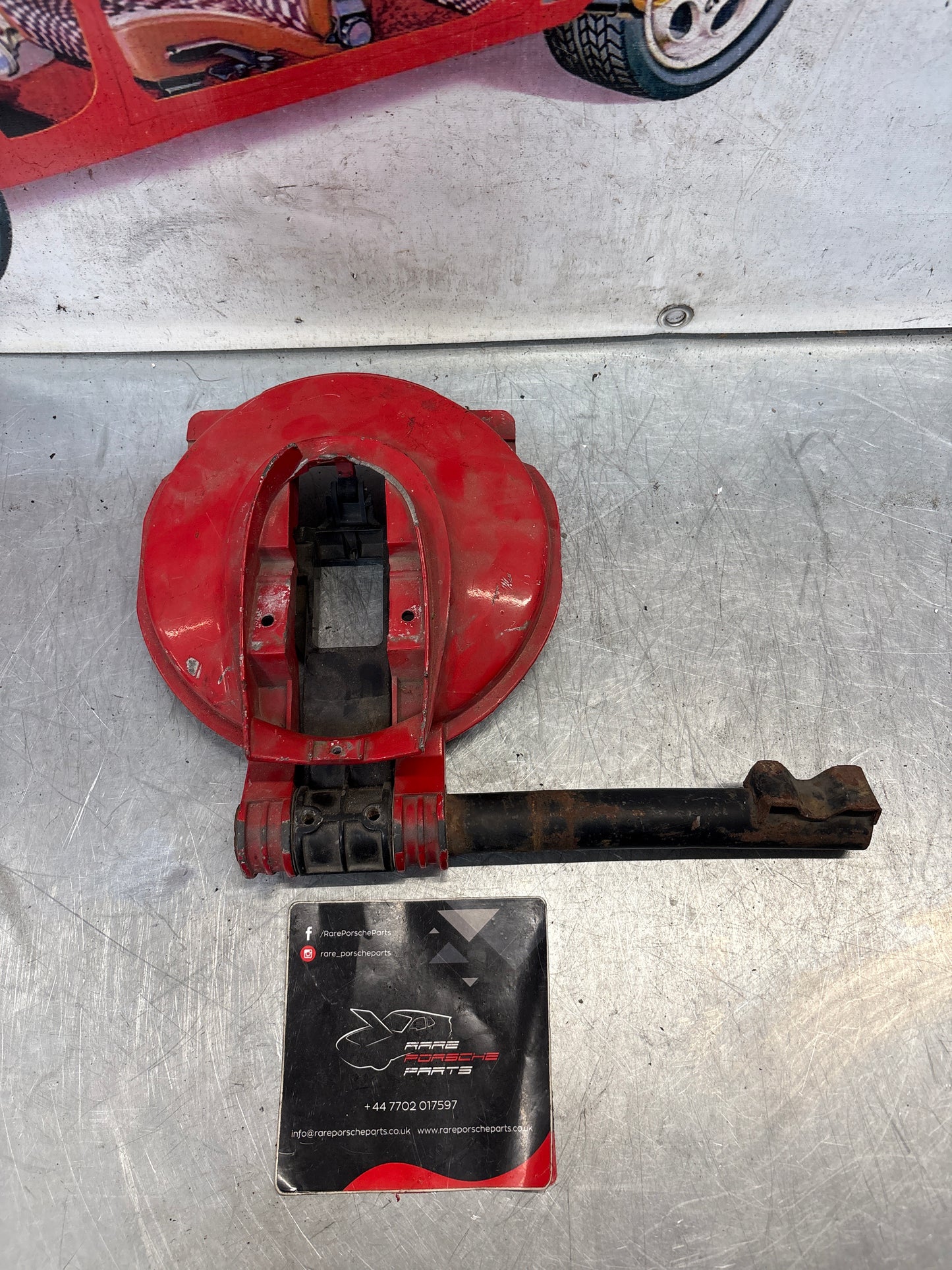 Porsche 928 left headlight swivel frame 92875024902 92875024302 used