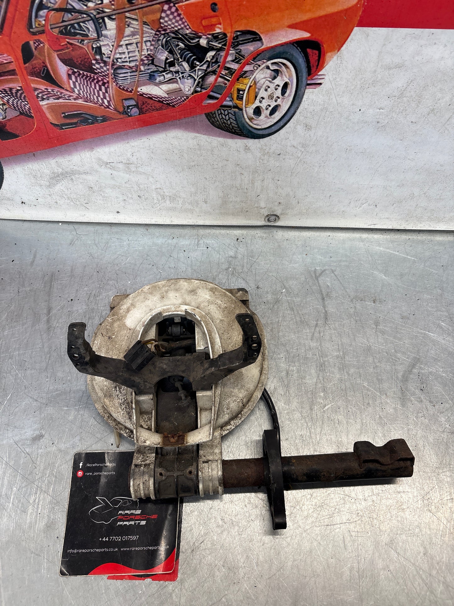 Porsche 928 left headlight swivel frame 92875024902 92875024302 used