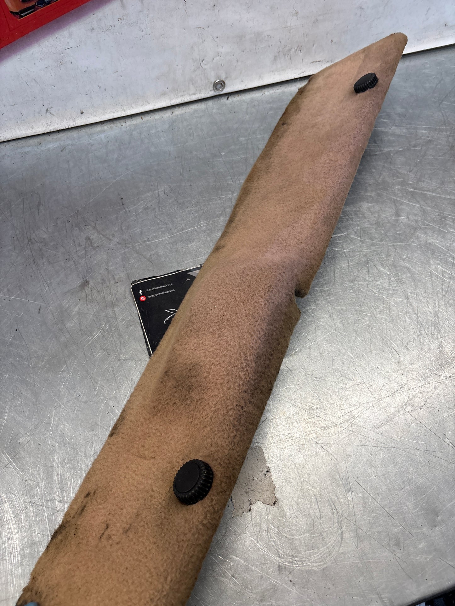 Porsche 928 greyish-beige carpeted Tool kit panel cover, used 92855118105