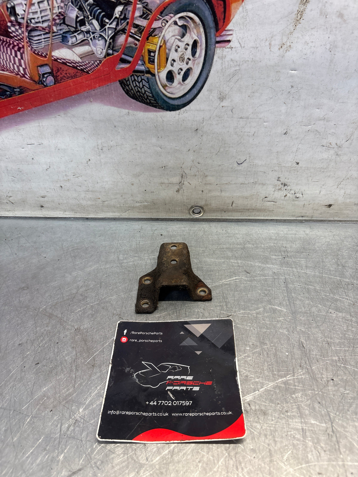 Porsche 924 944 hook trestle bracket, left, used 477399167E