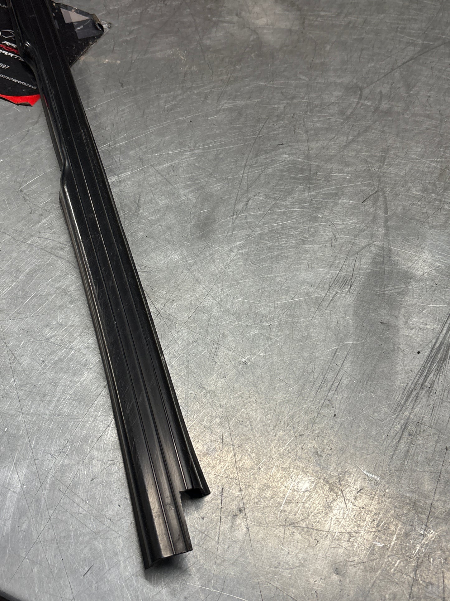 Porsche 944 85.5- left sill trim, scuff plate used 94455112100 cracked