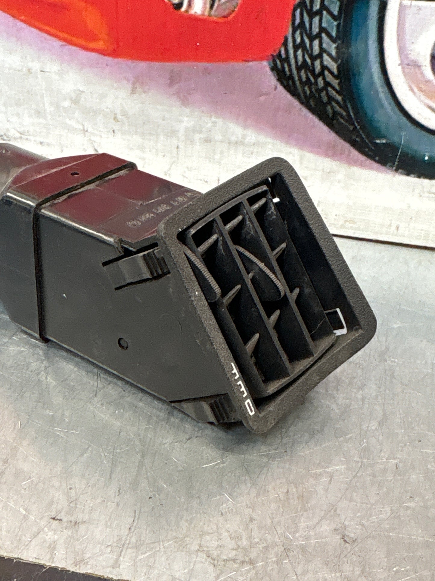 Porsche 924/944 Black dash air vent. left hand, with connecting piece 477819231 / 477819717 used