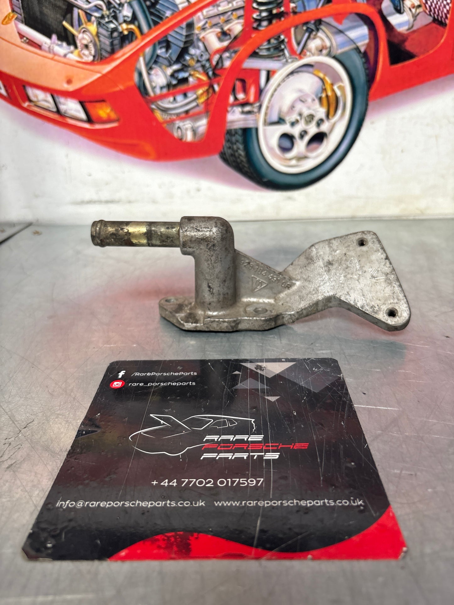 Porsche 928 water outlet housing, used 9281044310R