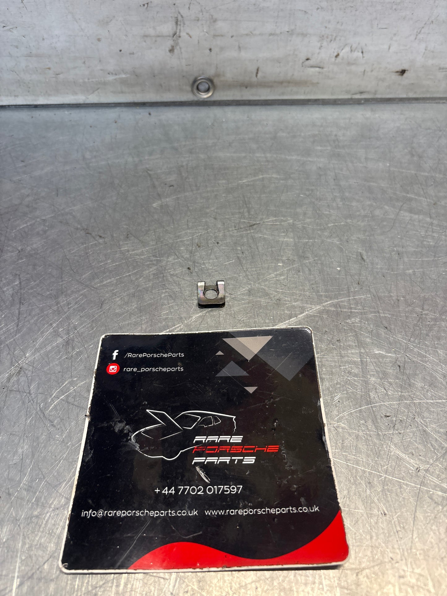 Porsche 928 reatining plate, used 99916603402
