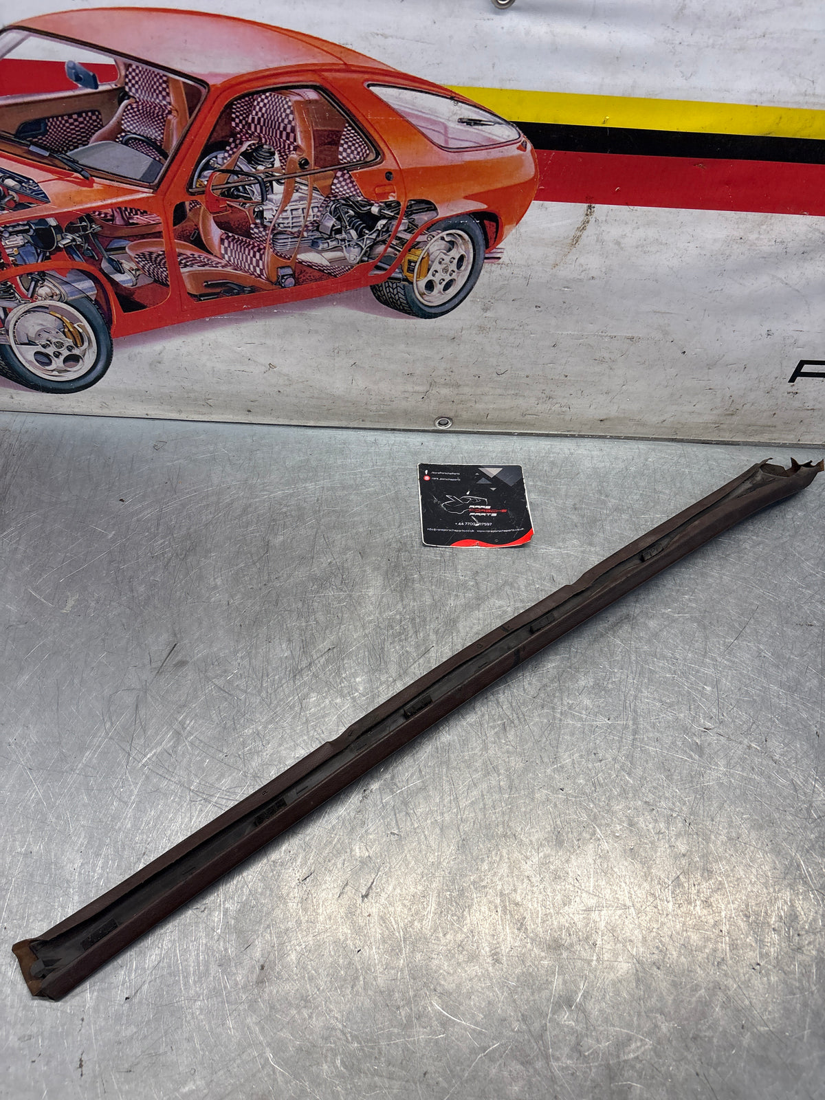 Porsche 928 tailgate trim, left, near side, brown, 92855503702, used