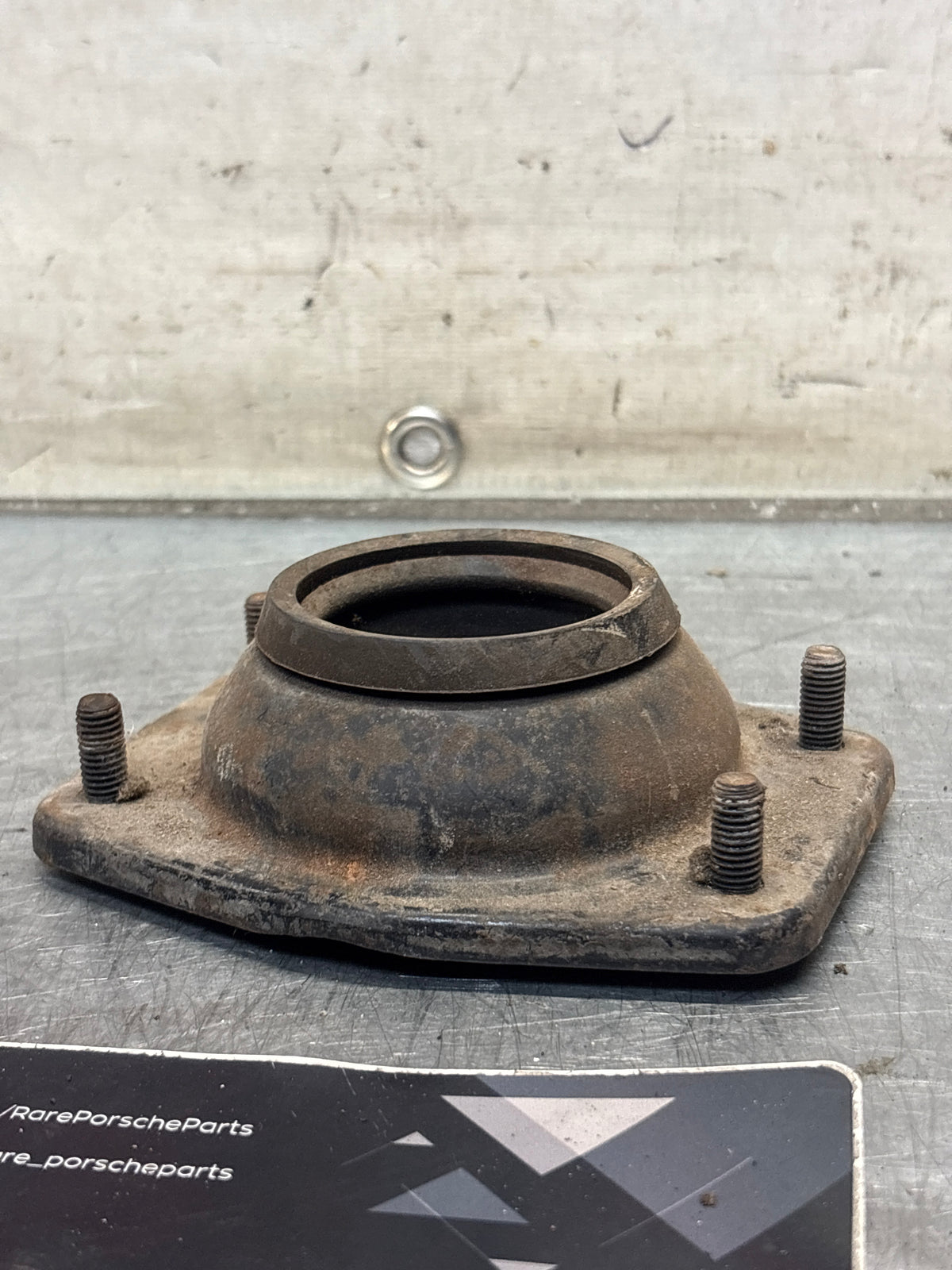 Porsche 924 / 944 front suspension bearing flange, 477412345, used