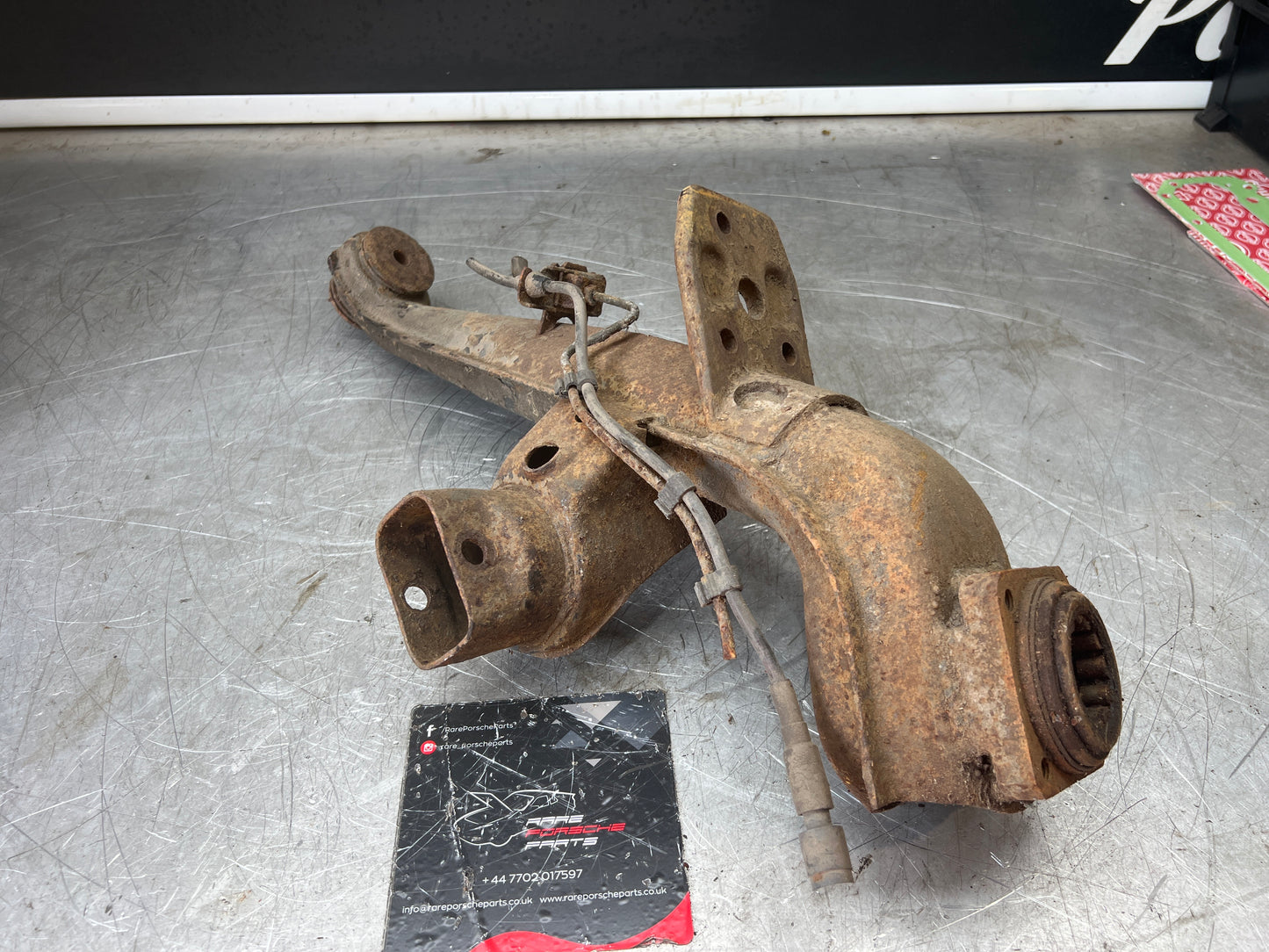 Porsche 924 944  -85.5 Rear left trailing arm, 94433102100