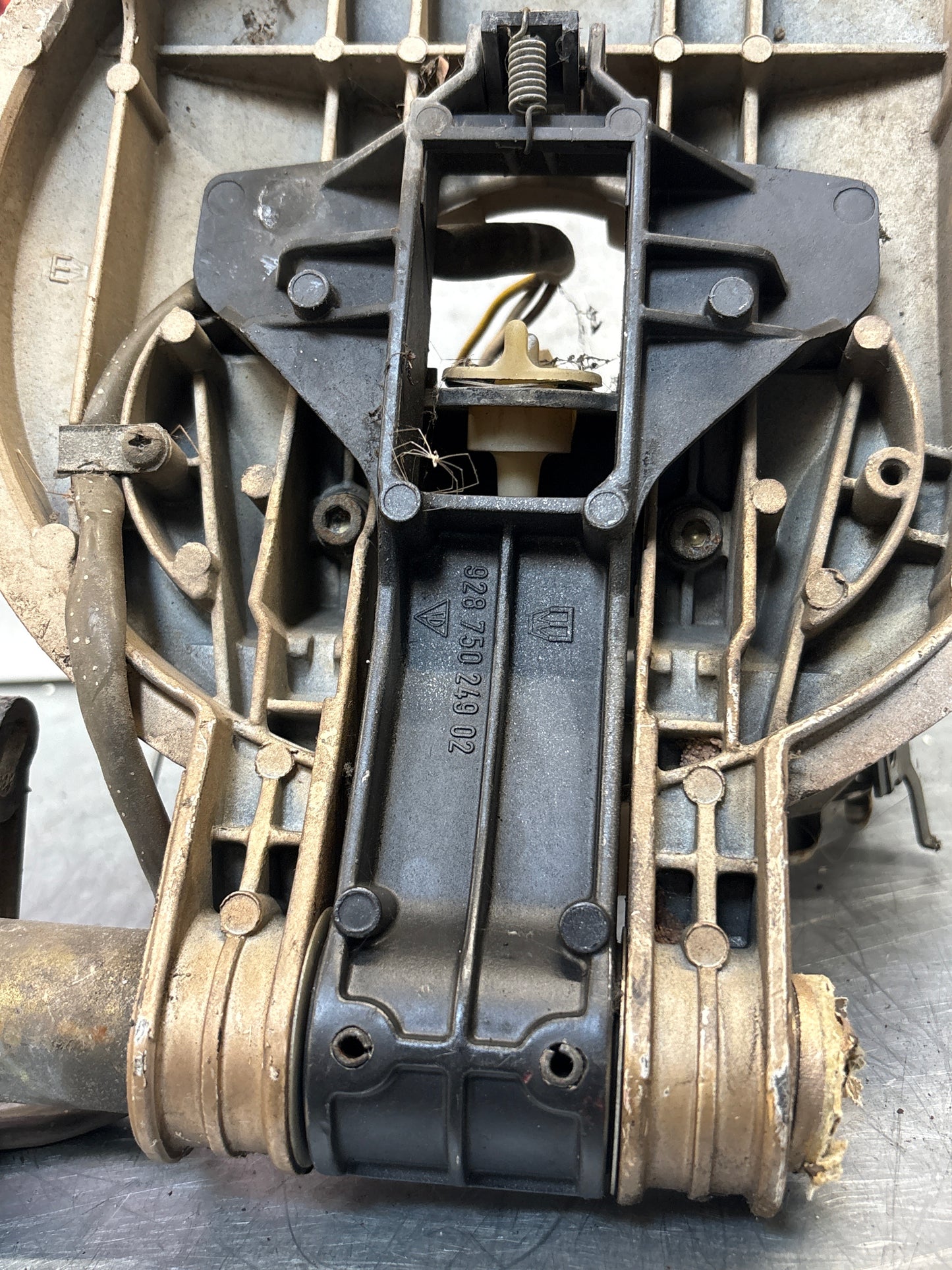 Porsche 928 left headlight swivel frame 92875024902 92875024302 used