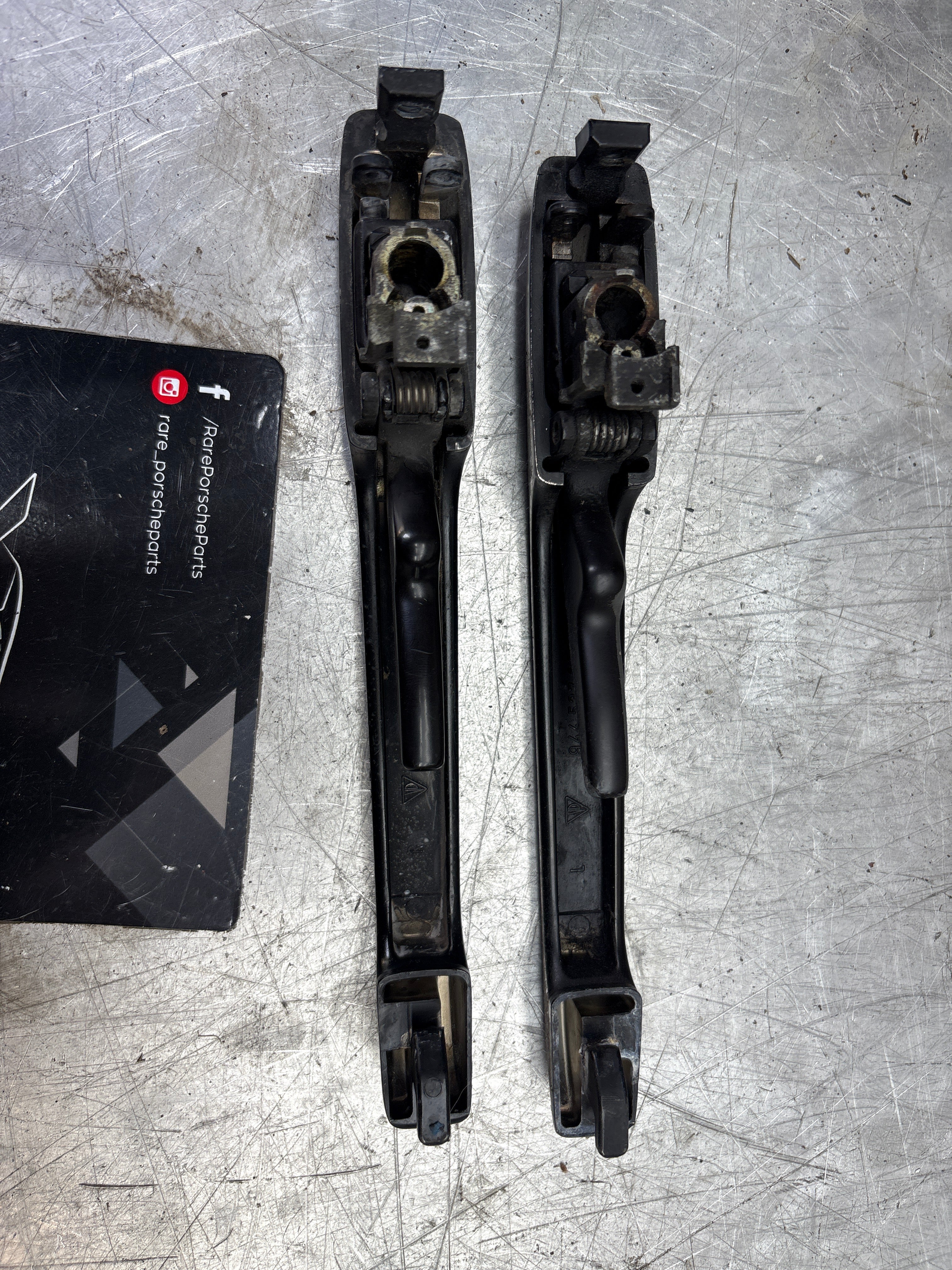 Porsche pair of 944 scripted door handle, used 94453706100