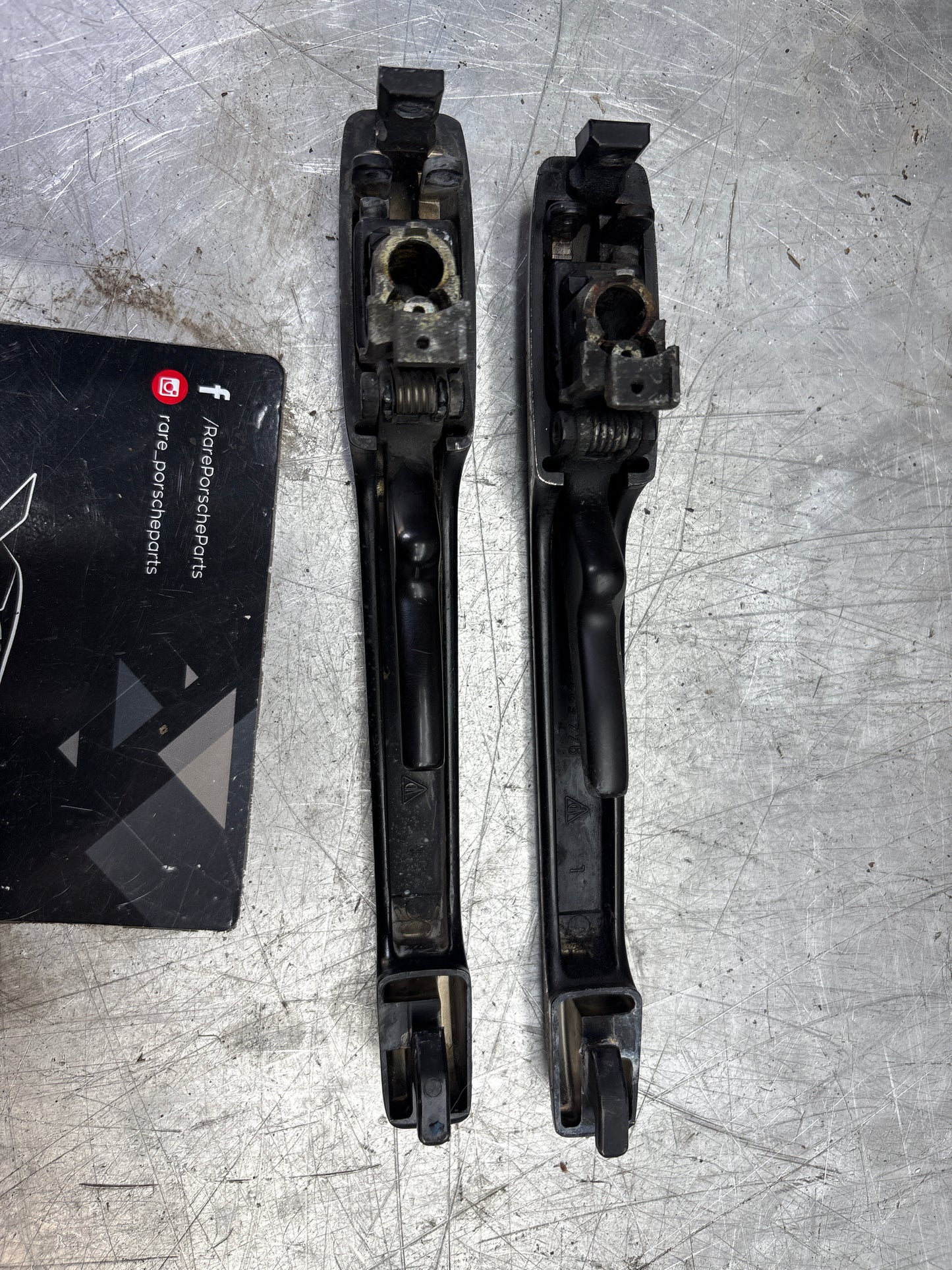 Porsche pair of 944 scripted door handle, used 94453706100 / 94453706200