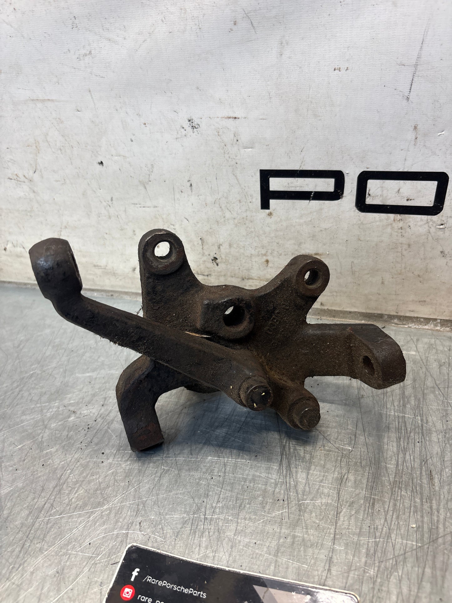 Porsche 928 left steering spindle knuckle, used 92834105703