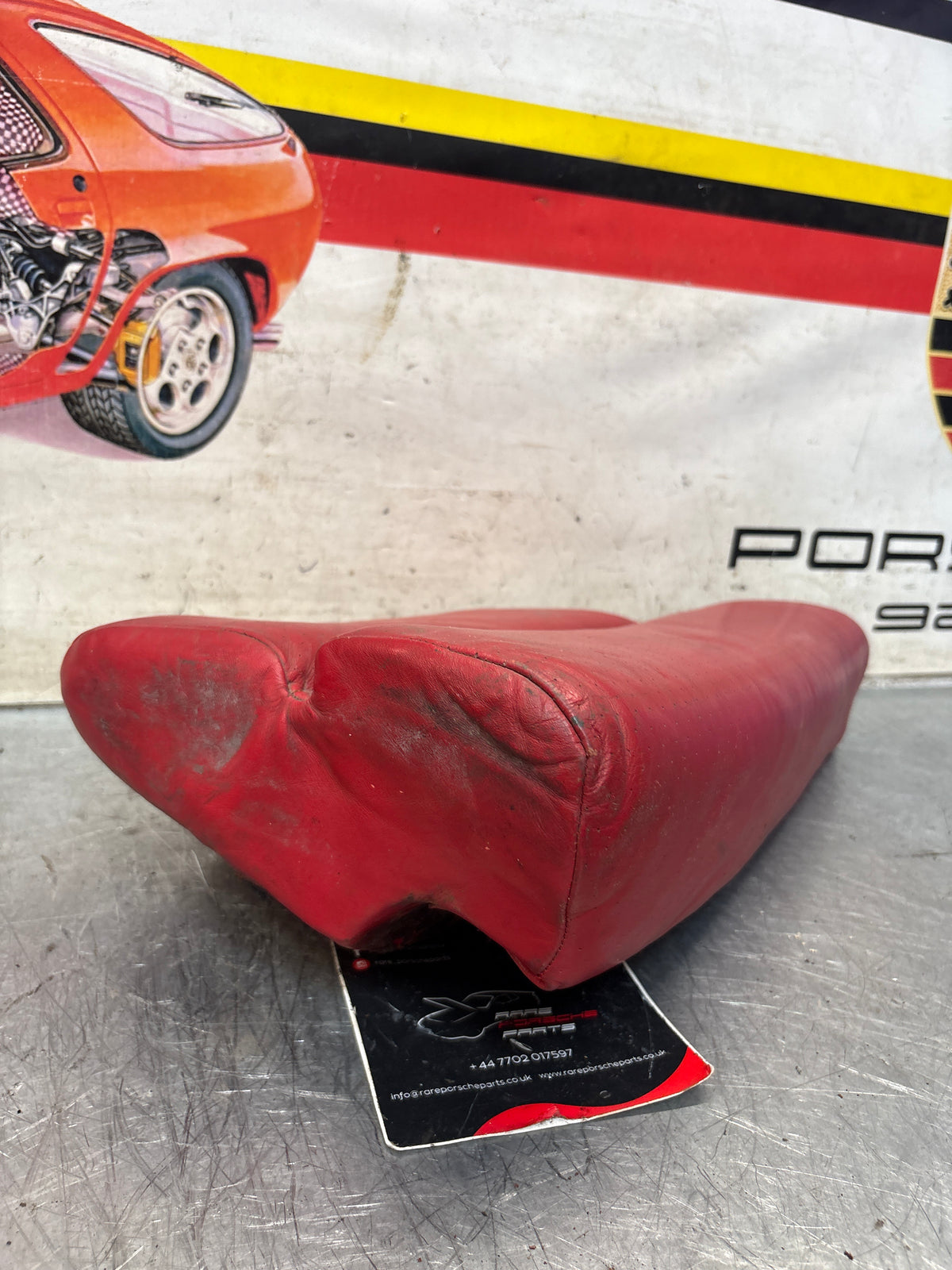 Porsche 928 rear left seat cushion, can-can red , leather, used 92852205951