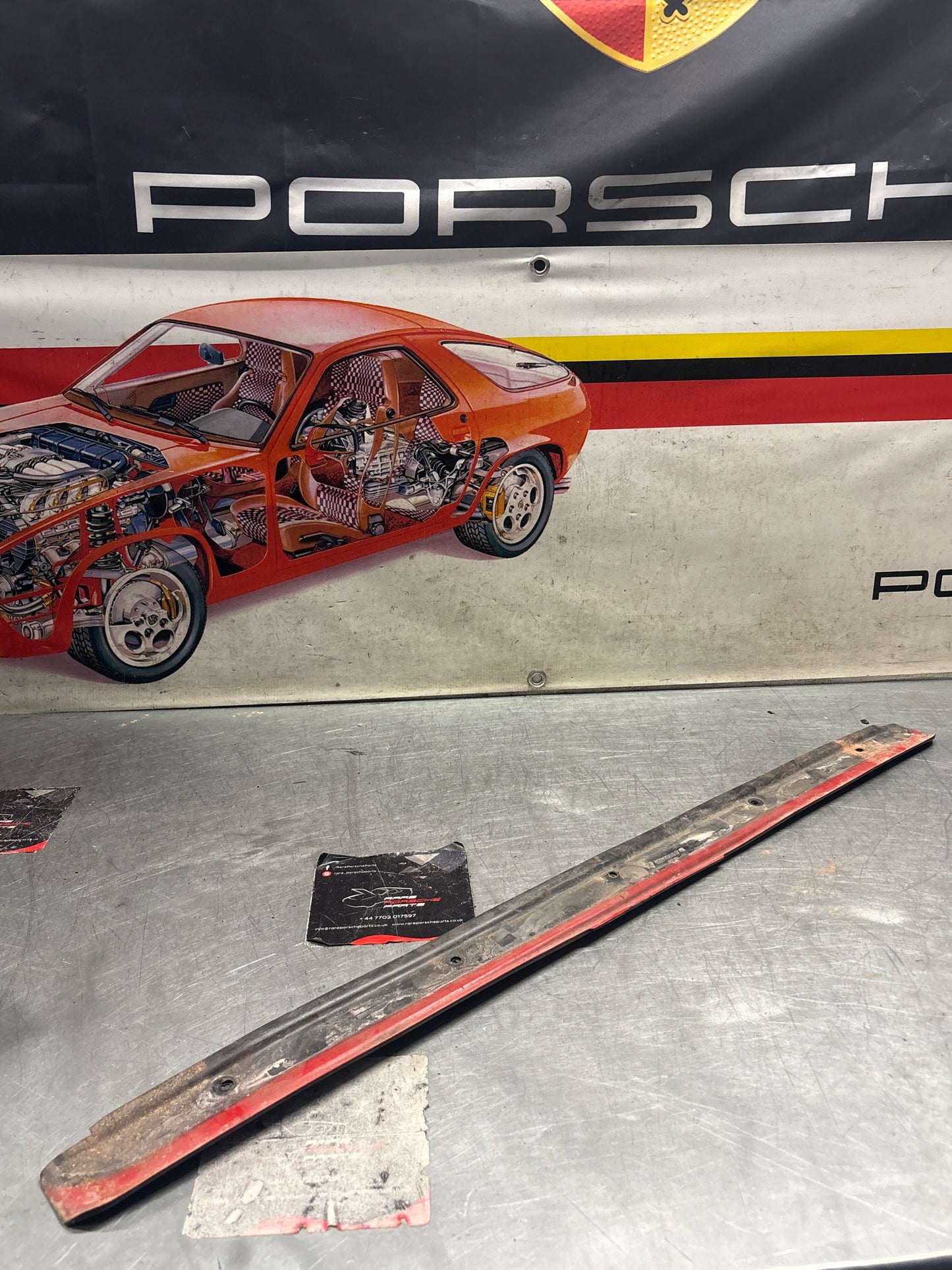 Porsche 928 water drain plate, used 92856416741