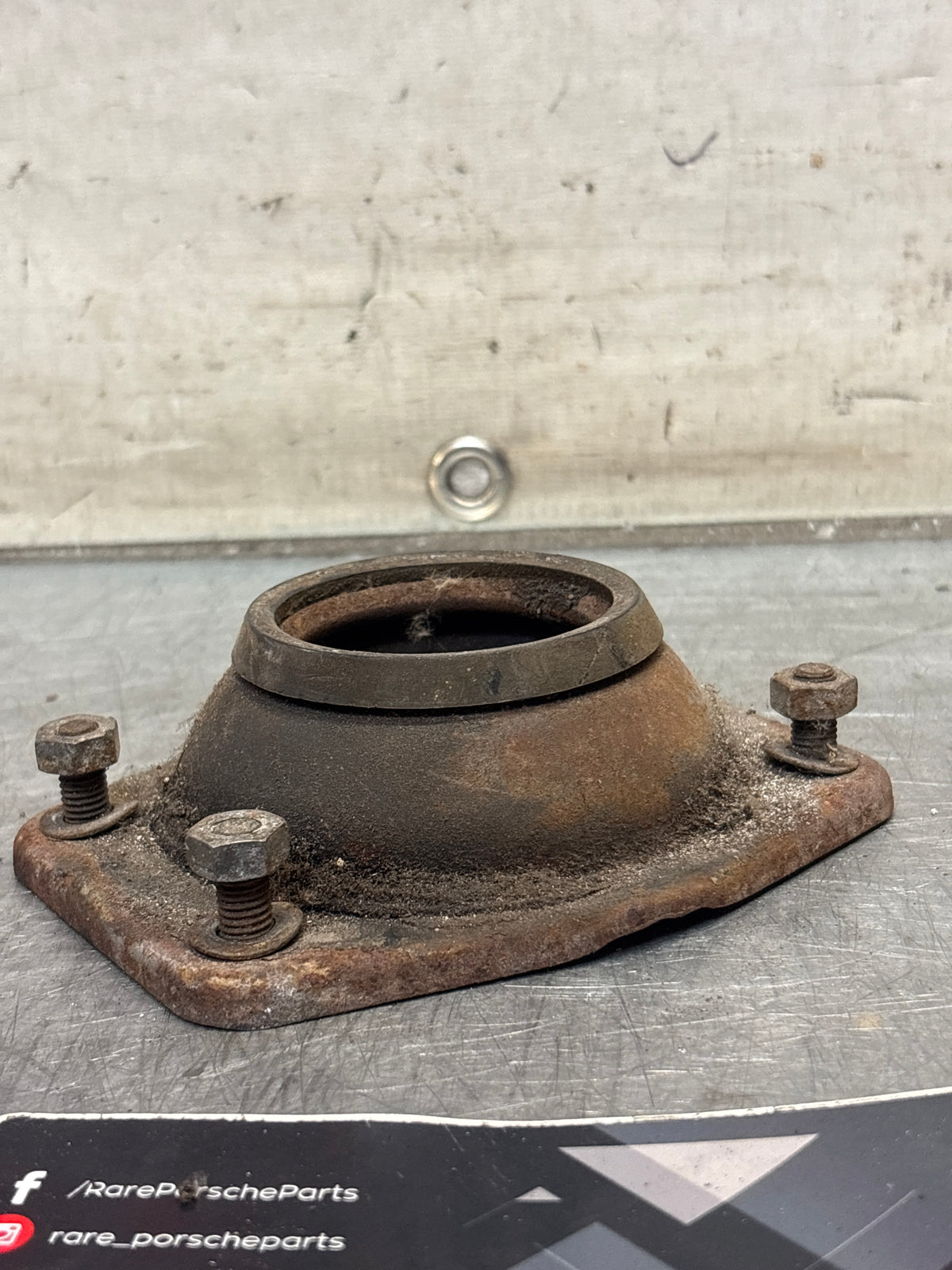 Porsche 924 / 944 front suspension bearing flange, 477412345, used