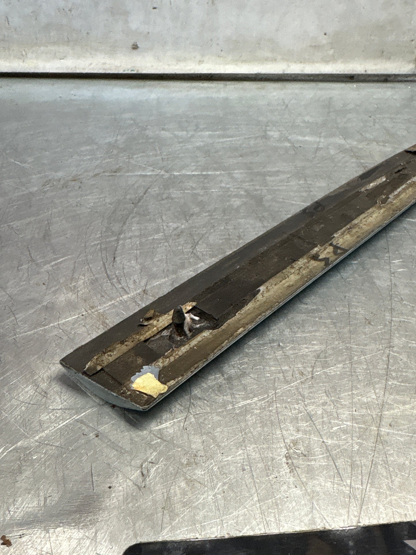 Porsche 928 left side front wing molding trim, used 92855903703