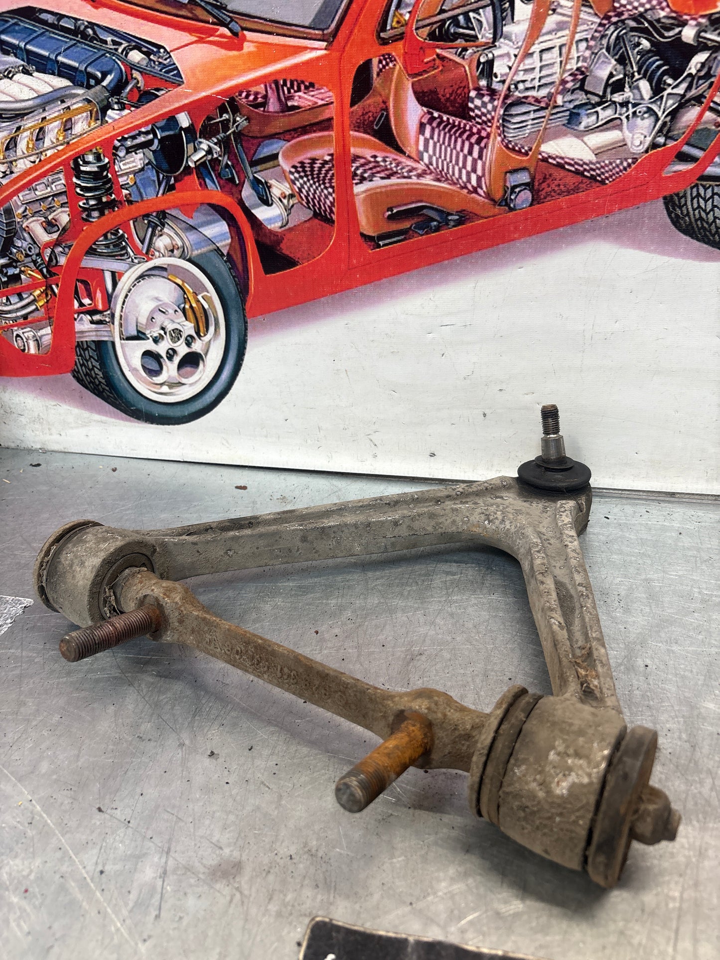 Porsche 928 front upper left control arm, used 92834145722