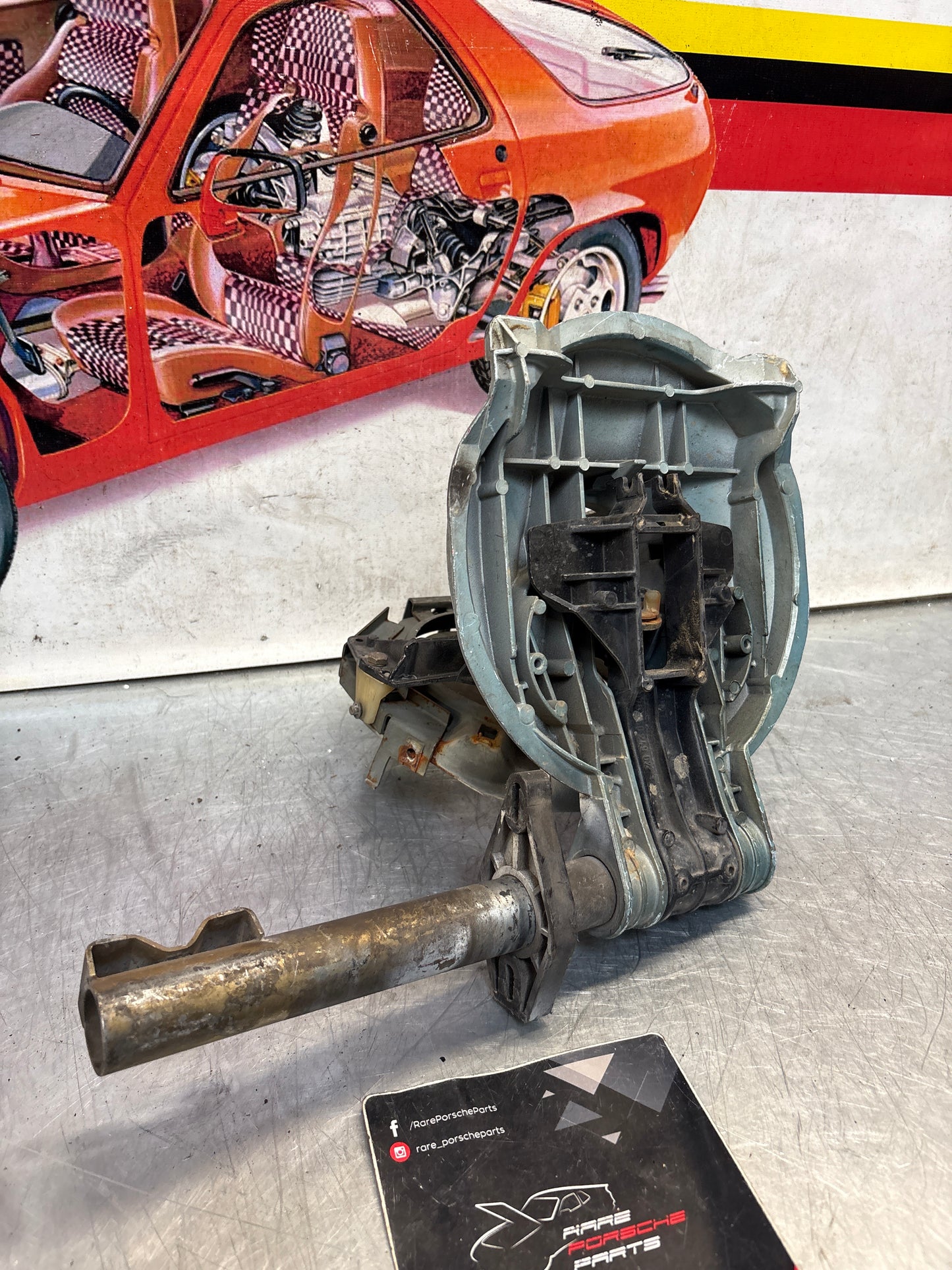 Porsche 928 left headlight swivel frame 92875024902 92875024302 used