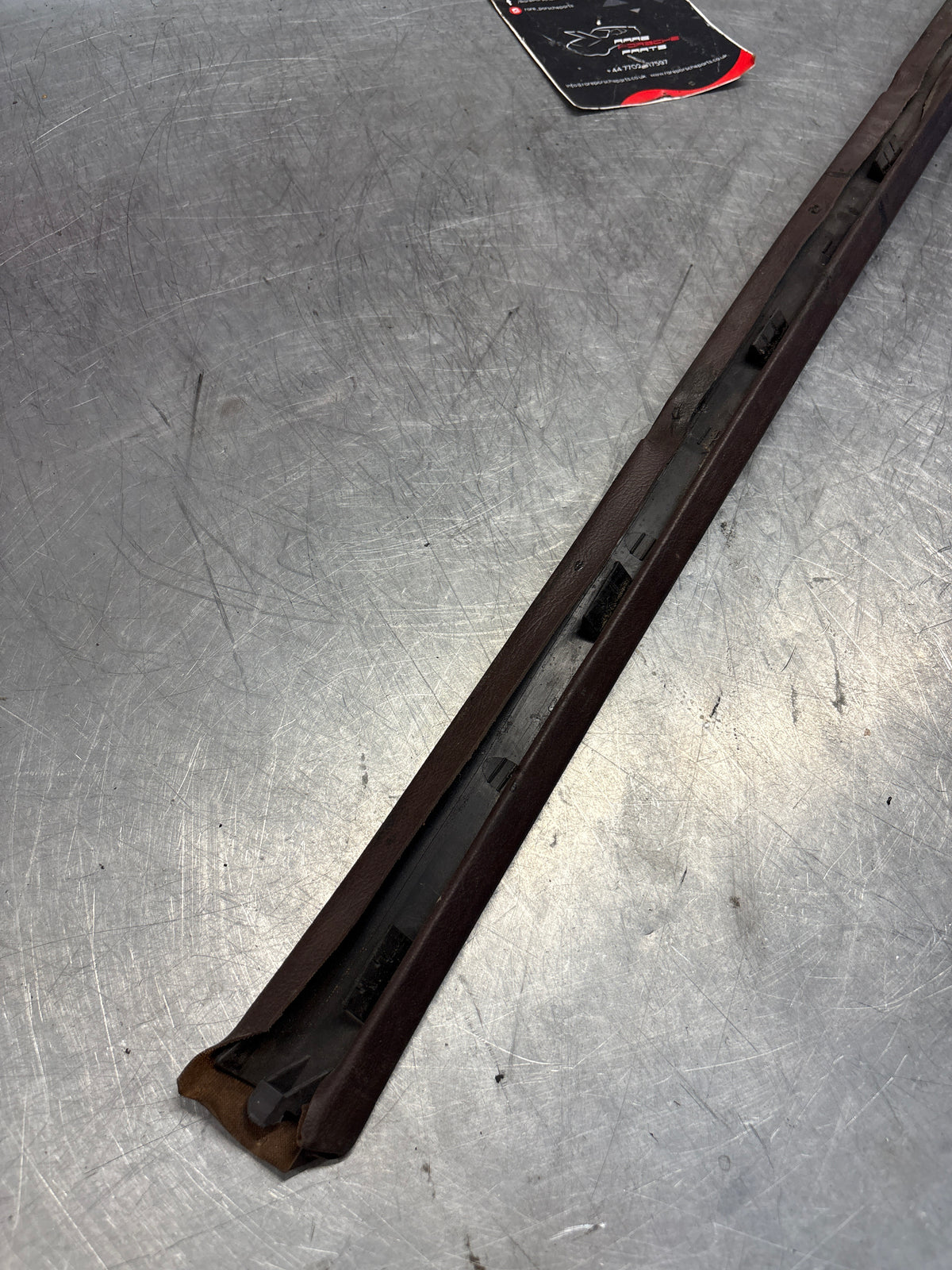 Porsche 928 tailgate trim, left, near side, brown, 92855503702, used