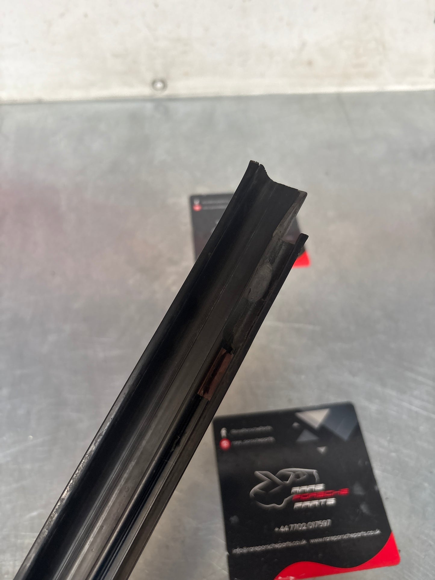 Porsche 944 85.5- left sill trim, scuff plate used 94455112100 cracked