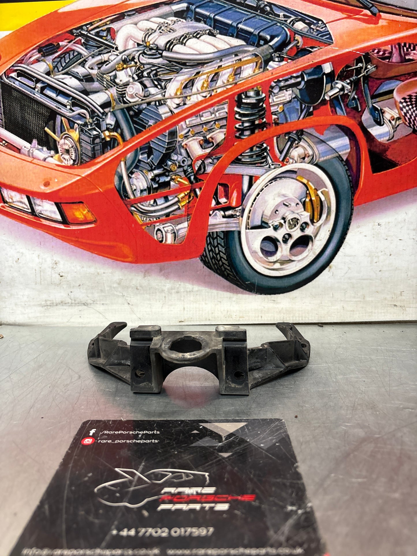 Porsche 928 headlight support arm, used 92875028502