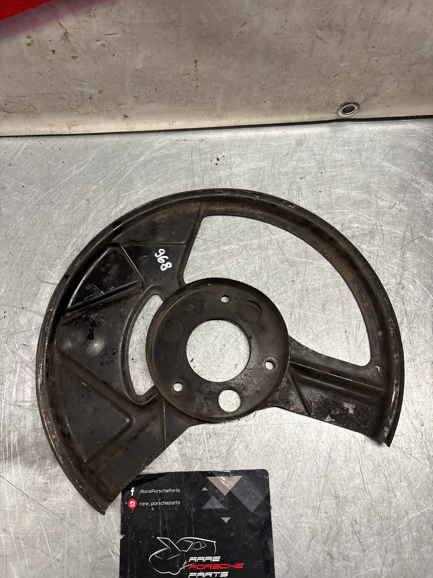Porsche 968 front left brake dust cover plate, used 95135180502
