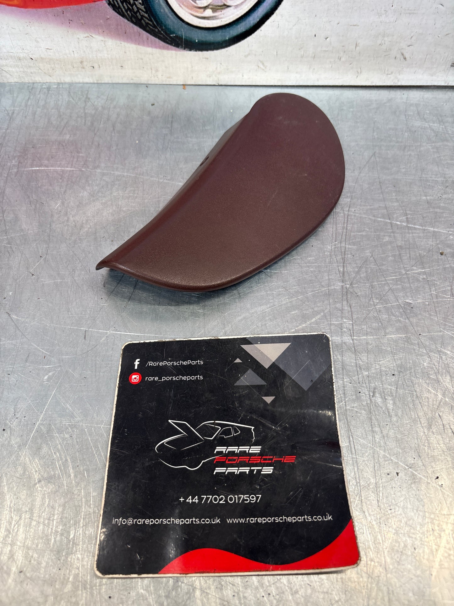 Porsche 928 seat hinge cover, burgundy, used 92852114702