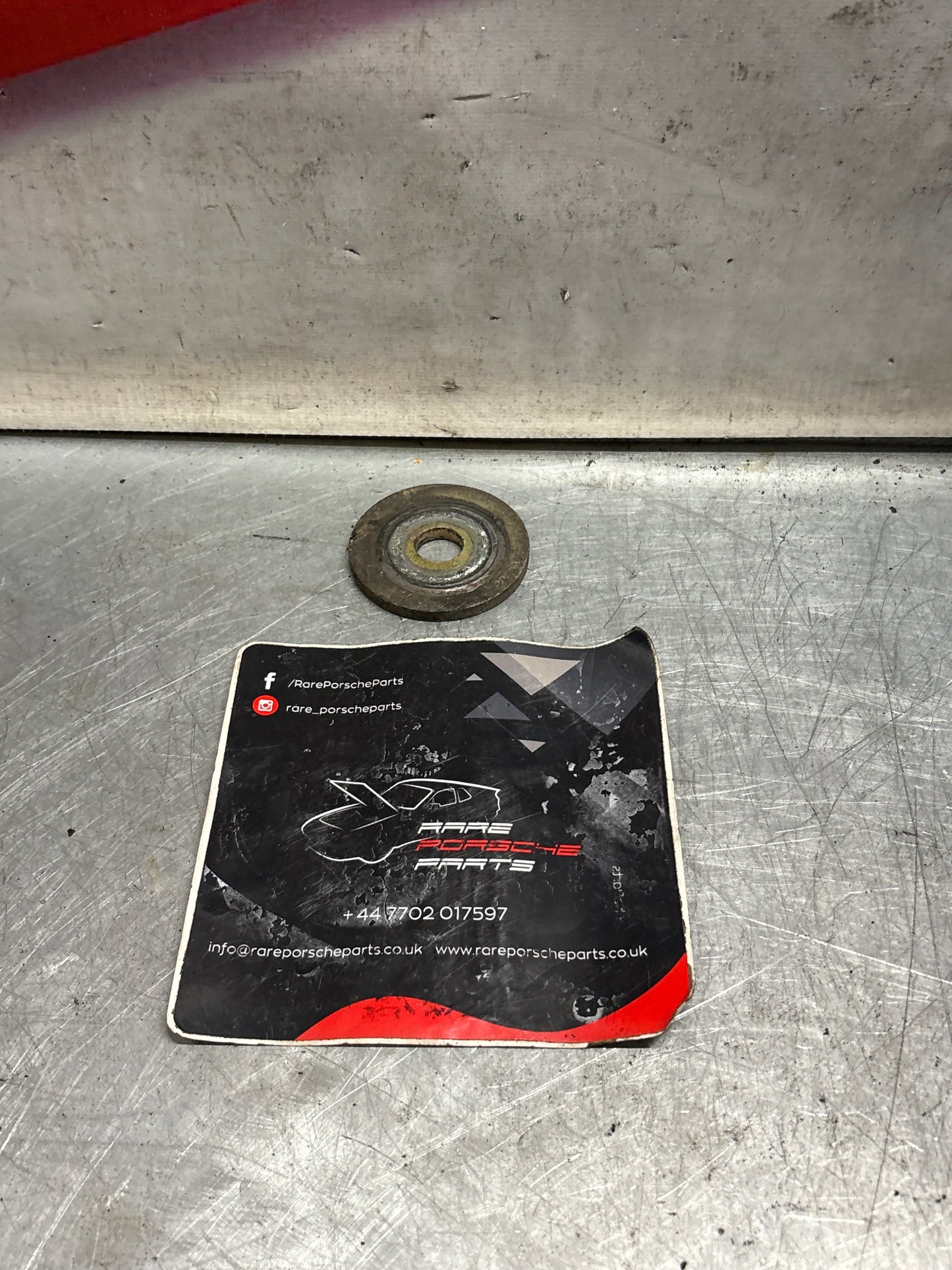 Porsche 928 wishbone bearing pin plate, used 92833164700