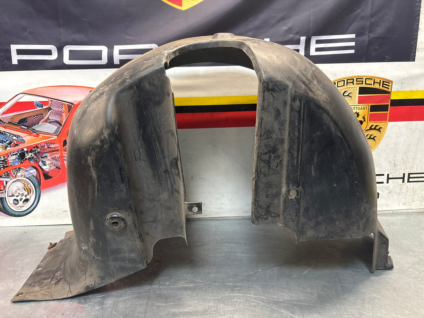 Porsche 944 from 85.5 wheel arch liner  Left, 94450438101 Used