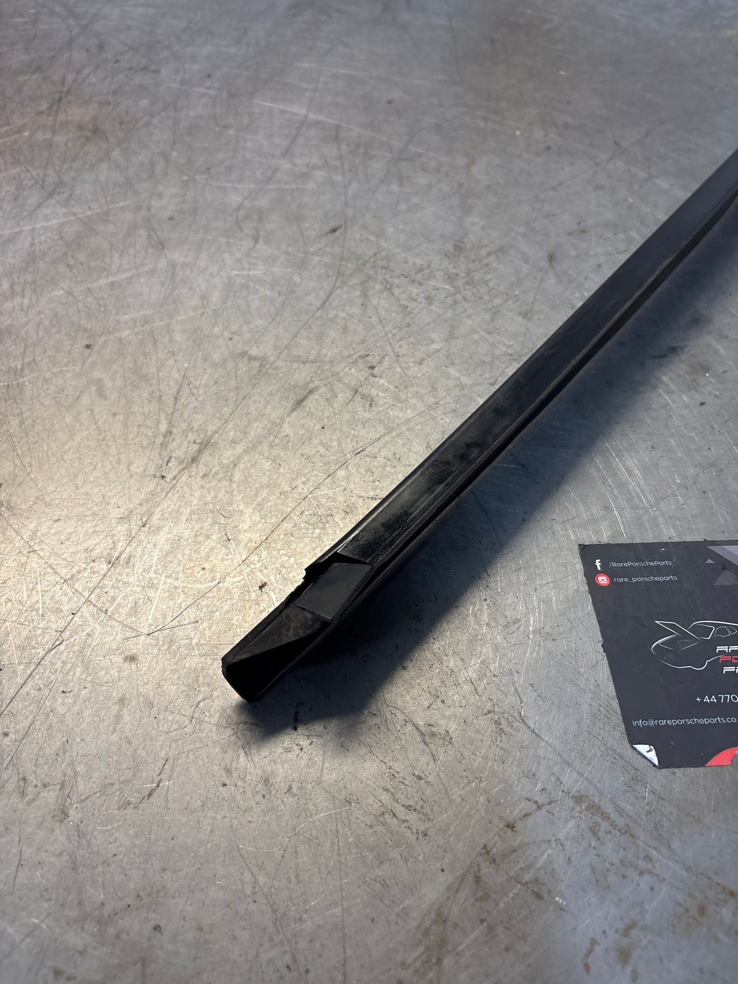 Porsche early 924/944 left sill trim, used 477853657A