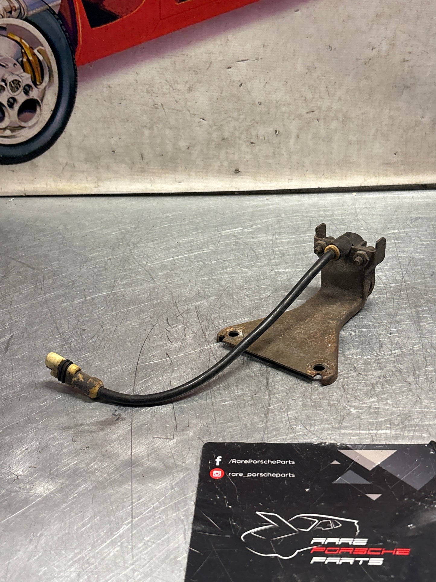 Porsche 928 tire pressure gauge with support bracket, used 92834108501