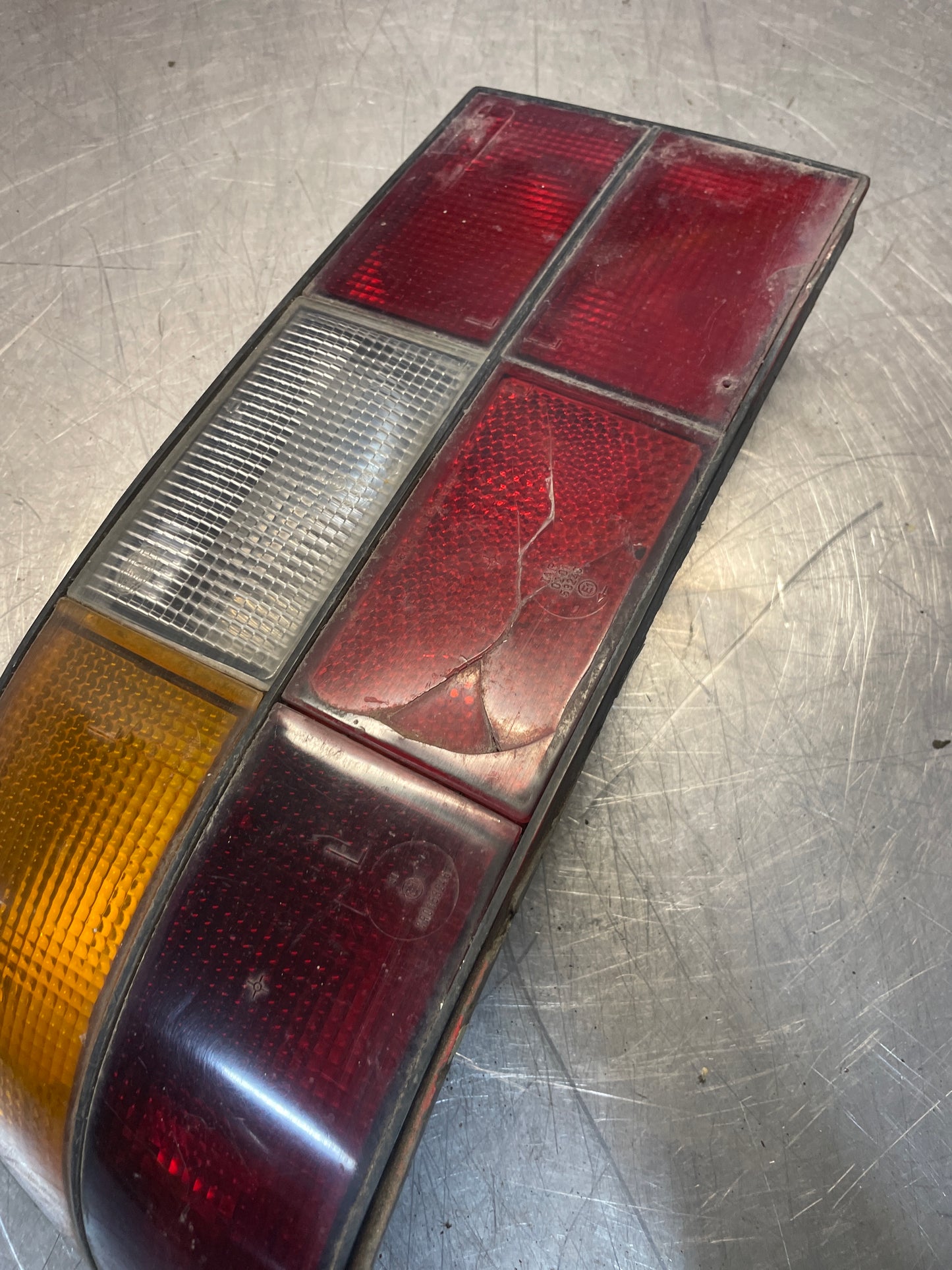 Porsche 924 / 944 left tail light, used, cracked