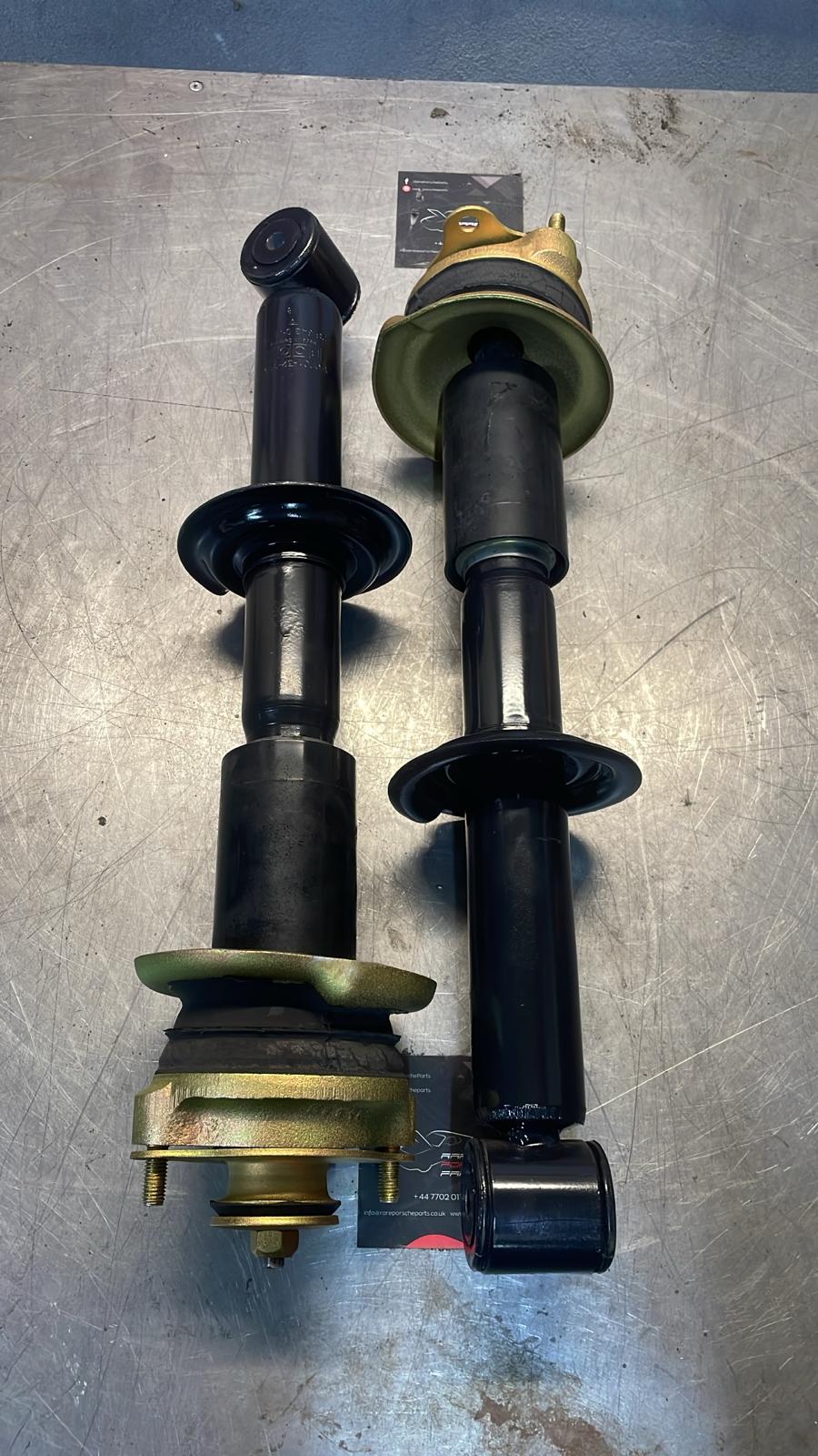 Porsche 928 78-85 pair of front shock absorber with to spring plate, refurbished 92834305504, 92834304708