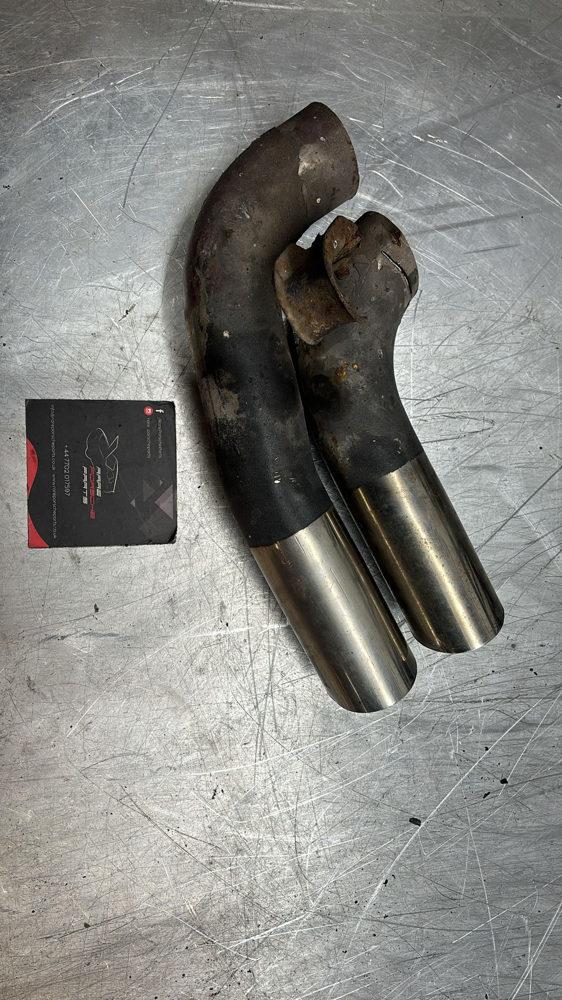 Porsche 928S pair of cut exhaust tips, used 92811127103, spares or repiar