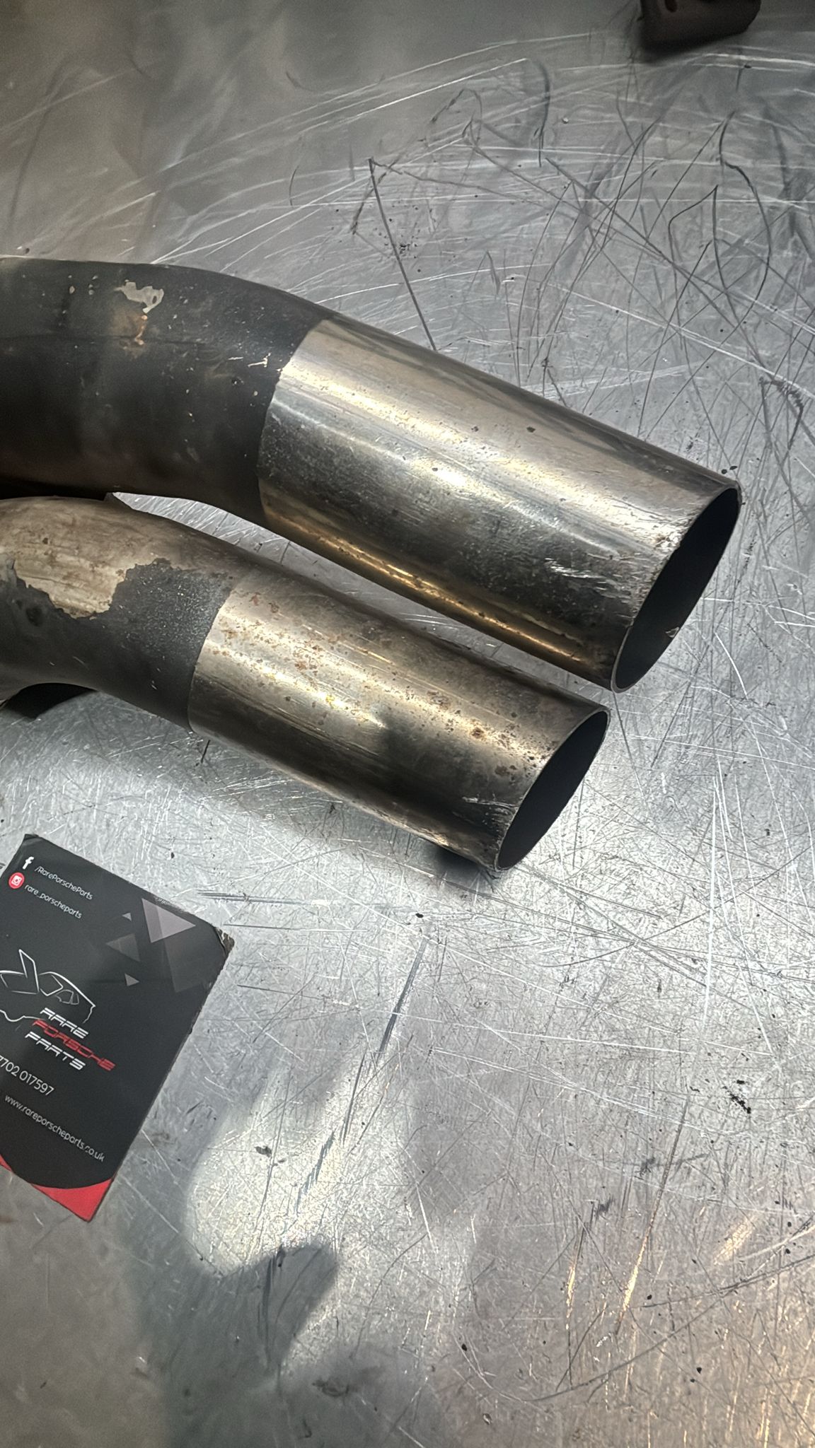 Porsche 928S pair of cut exhaust tips, used 92811127103, spares or repiar