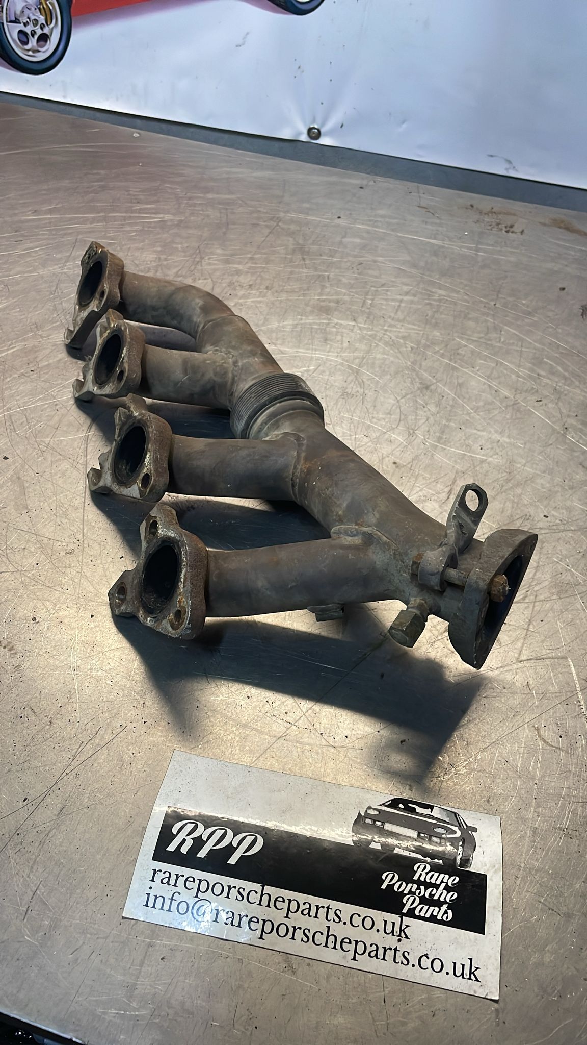 Porsche 928 S4 exhaust manifold, left 92811114507, used